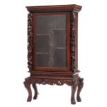 An Oriental richly carved exotic hardwood display cabinet on stand, H 117 - 172 cm