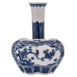 A Chinese lobed blue and white floral decorated bottle vase, the roundels with birds and flower