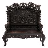 A Japanese richly carved wooden bench with phoenix and dragon relief decorated, H 145 - W 140 - D 57