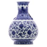 A Chinese blue and white lotus decorated pear shaped vase, Qianlong marked and possibly period, H 52