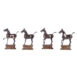 Four Chinese sterling silver horses, standing on a textile covered base, 20thC, H horses 11,4 - H