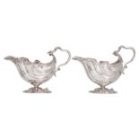 A pair of probably 18thC early George III silver sauce boats, presumably London hallmark, H 16,5 - W