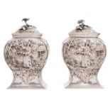 A pair of George II sterling silver chinoiserie decorated tea caddies, London hallmark, date