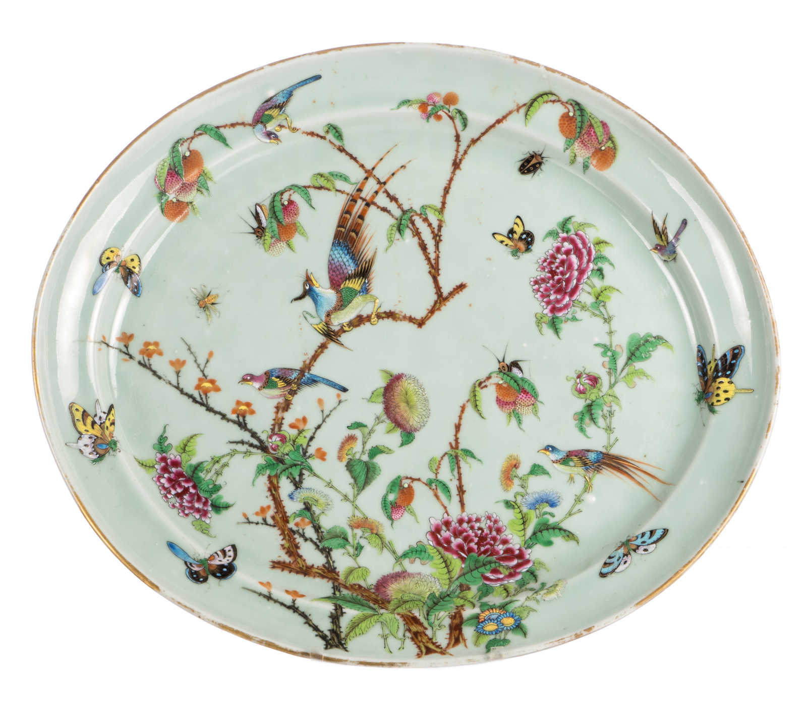 A Chinese oval celadon ground famille rose decorated plate with birds on flower branches and