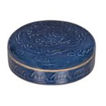 A Chinese blue monochrome glazed box and cover with low relief dragon decoration, H 7,5 cm - ø 22
