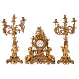 A French Rococo revival gilt bronze three-piece garniture, the dial unreadably marked (Paris...),