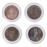 Four different Chinese silver coins decorated with official portraits, so-called 'fleurs de coin', ø