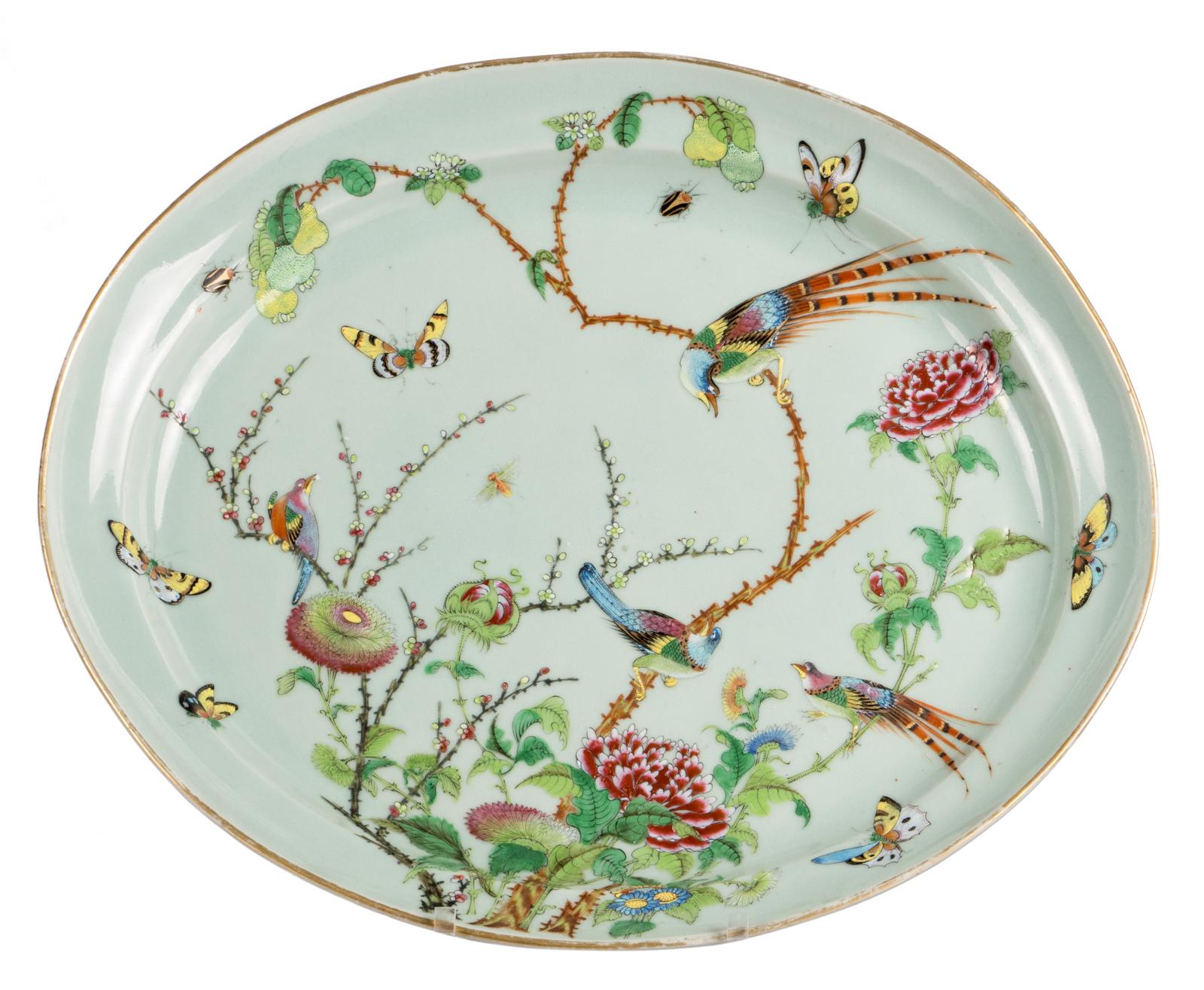 A Chinese oval celadon ground famille rose decorated plate with birds on flower branches and