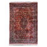 An Oriental silk rug, floral decorated, 125 x 181,5 cm