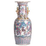 A Chinese famille rose floral and relief decorated vase, the roundels with court scenes and