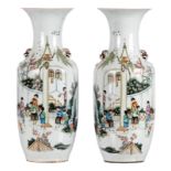 A pair of polychrome decorated vases, with an animated scene and calligraphic texts, H 58 cm