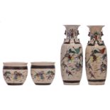 Two Chinese polychrome stoneware vases, decorated with a battle scene, marked; added a pair of ditto