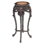 A Chinese richly carved hardwood stool with marble top, H 90 cm - ø 34 cm