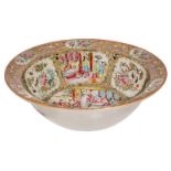 A Chinese Canton famille rose floral decorated bowl, the roundels with court scenes, birds,