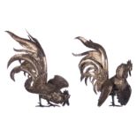 A pair of silver fighting cocks, no marks visible but both tested on silver purity, (possibly