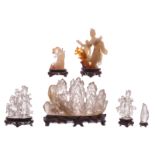 A various of six Chinese carved glass, stone and rock crystal groups, H 8,5 - 18 cm