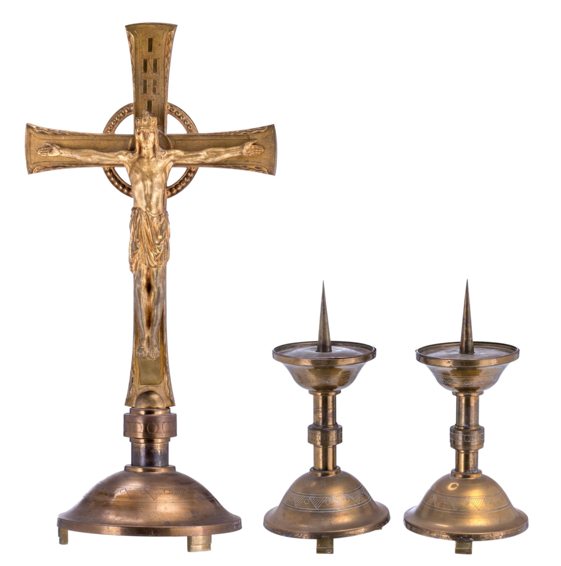 A 50s or 60s cast brass crucifix and two accompanying candlesticks, H 82 - W 39 cm