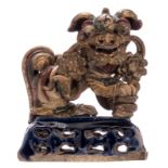 A Japanese polychrome glazed stoneware Shishi, gilt and polychrome decorated, marked, 19thC, H