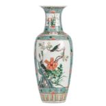 A Chinese famille verte baluster shaped vase, floral decorated, the roundels with birds and flower