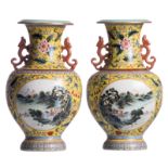 A pair of Chinese yellow ground polychrome and floral decorated vases, the roundels with mountainous