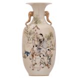 A Chinese polychrome decorated vase with an animated scene and calligraphic texts, the handles