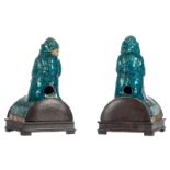 Two Chinese blue glazed bird shaped terracotta roof tiles, Ming, mounted on a wooden stand, H 22