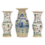 A pair of Chinese famille rose yenyen vases, overall decorated with antiquities and flower branches;