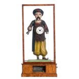 A polychrome painted wooden mantle clock depicting an Ottoman, in a walnut cabinet, H 45,5 cm - W