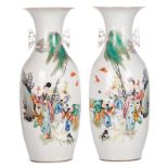 A pair of Chinese polychrome decorated vases with a lady and boys playing in a garden and