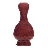 A Chinese sang de boeuf double gourd vase with a Yongzheng mark, H 43,5 cm