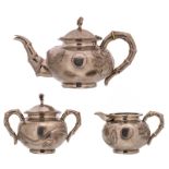 An Eastern three-piece silver tea set, marked Yoksang, probably Indonesian, decorated with
