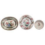 Two Chinese famille rose floral decorated export porcelain plates and a ditto dish, the oval plate