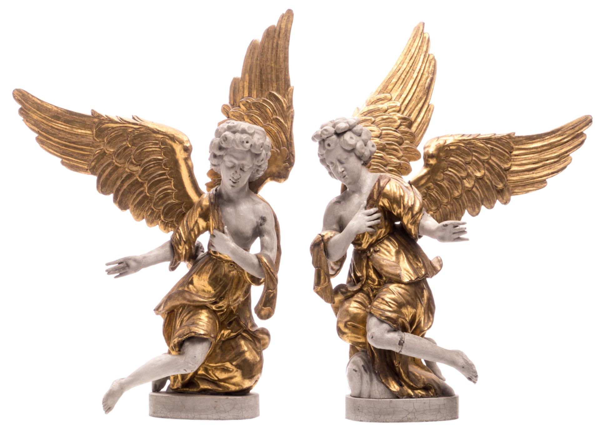 A pair of 18thC polychrome and gilt decorated limewood altar angels, H 84 cm