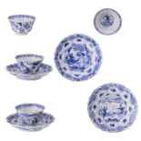 Four Chinese blue and white floral decorated cups and saucers, the roundels with a warrior scene,