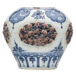 A Chinese cobalt blue and copper red glazed vase, the roundels floral relief decorated, Ming, H 30