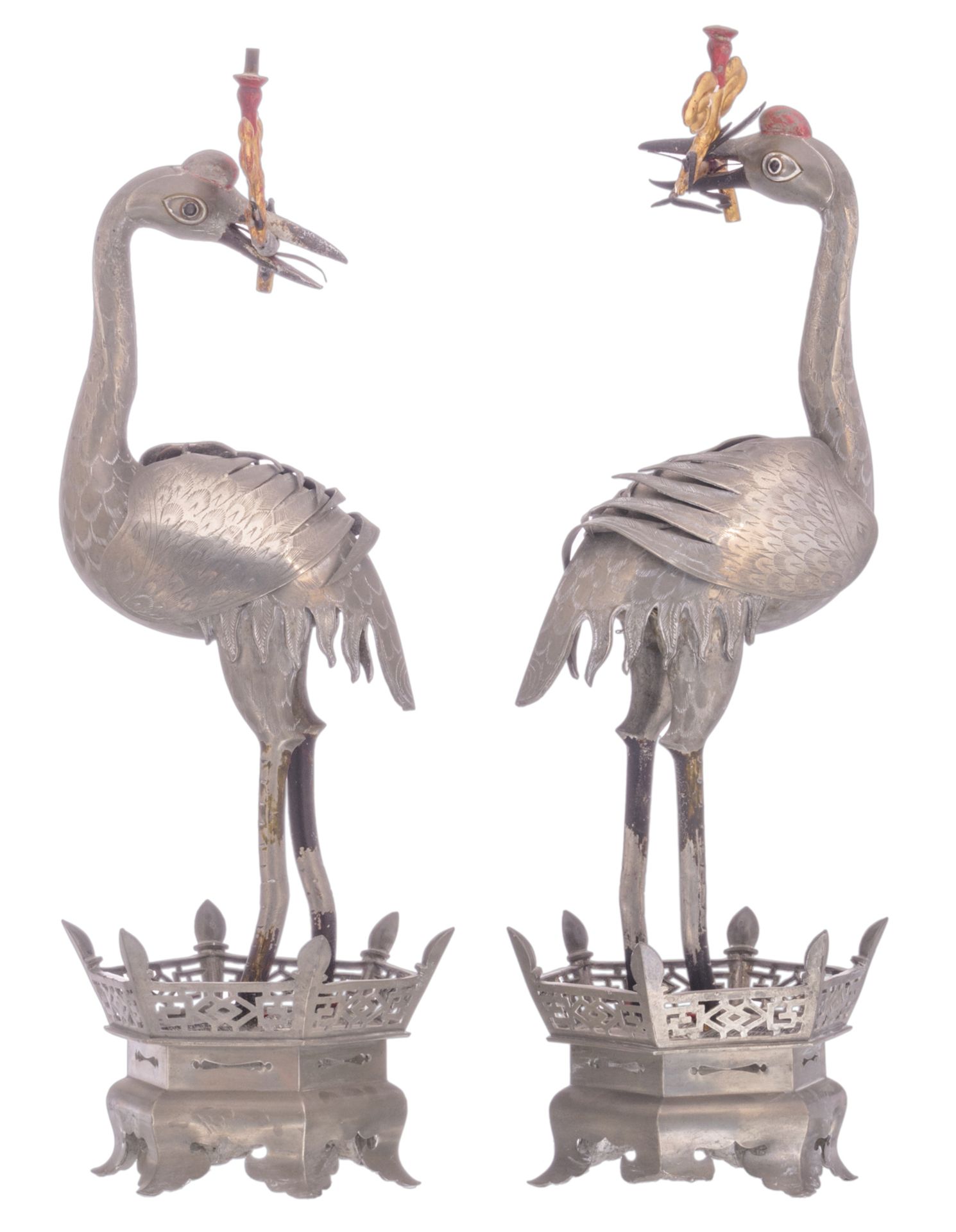 A Chinese pair of polychrome decorated pewter candlesticks, modelled as cranes, marked, H 48 cm