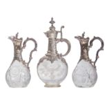 Two cut crystal liqueur decanters with Rococo revival silver mount, French export silver; added a