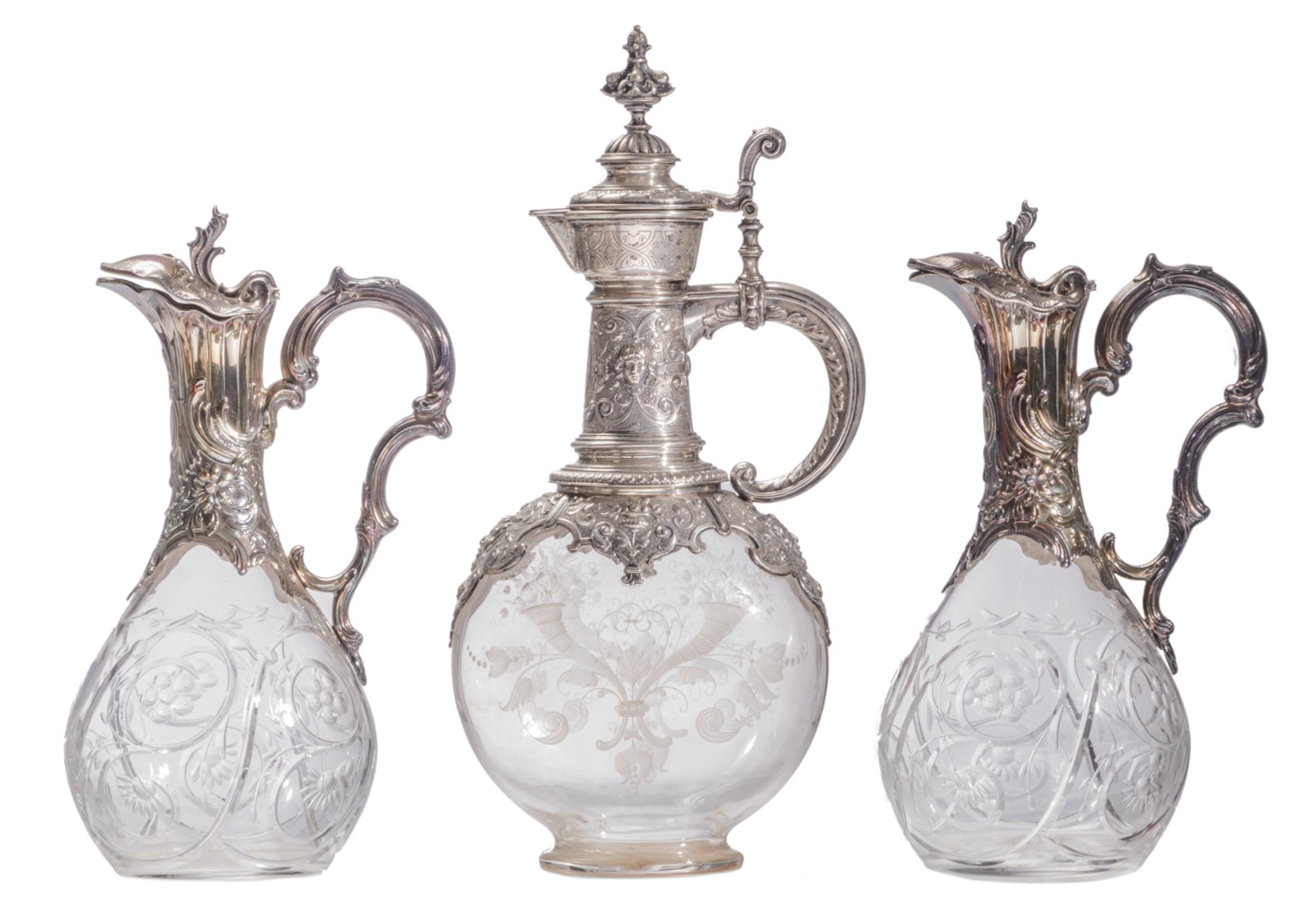 Two cut crystal liqueur decanters with Rococo revival silver mount, French export silver; added a