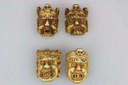 Vier Miniaturmasken, Asien/Thailand, Knochen. H. ca. 5,5 cm. -