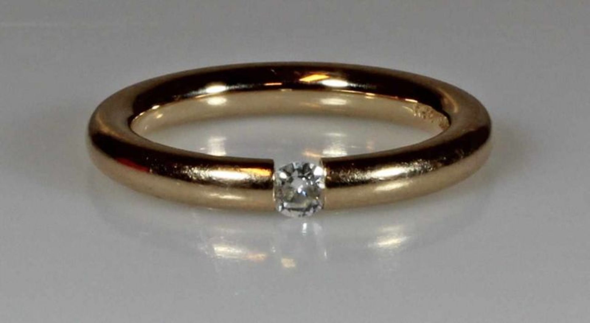 Spannring, Niessing, GG 750, 1 Brillant ca. 0.10 ct., 8 g, RM 18.5 20.00 % buyer's premium on the