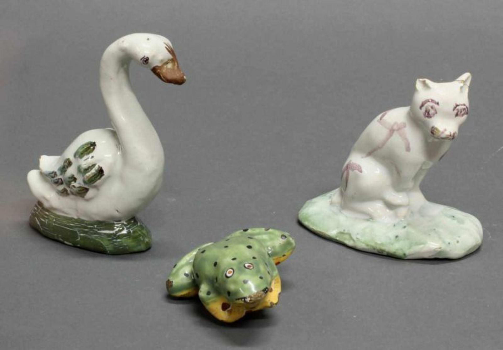 3 Fayencefiguren, "Schwan", "Frosch", "Katze", wohl Delft bzw. Brüssel (Katze), 18 Jh., ungemarkt,