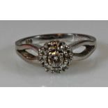 Ring, WG 585, 1 Brillant ca. 0.15 ct., 8 kleine Besatz-Brillanten, 5 g, RM 17.5 20.00 % buyer's