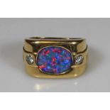 Ring, GG 750, Opal-Triplette, 2 Brillanten, 11 g, RM 17 20.00 % buyer's premium on the hammer