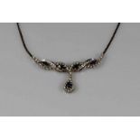 Collier, WG 585, 5 facettierte Saphire, 41 Brillanten zus. ca. 1.25 ct., 16 Besatz-Diamanten, 17