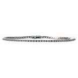 Rivieren-Armband 750/-WG, 21.Jh. Zartes Band ausgefasst m. Brillanten, zus. ca. 1 ct. tcr si, in