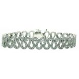 Brillant-Armband 750/-WG, 21.Jh. Band in Wellenform ausgefasst m. Brillanten, zus. ca. 4,40 ct. w-