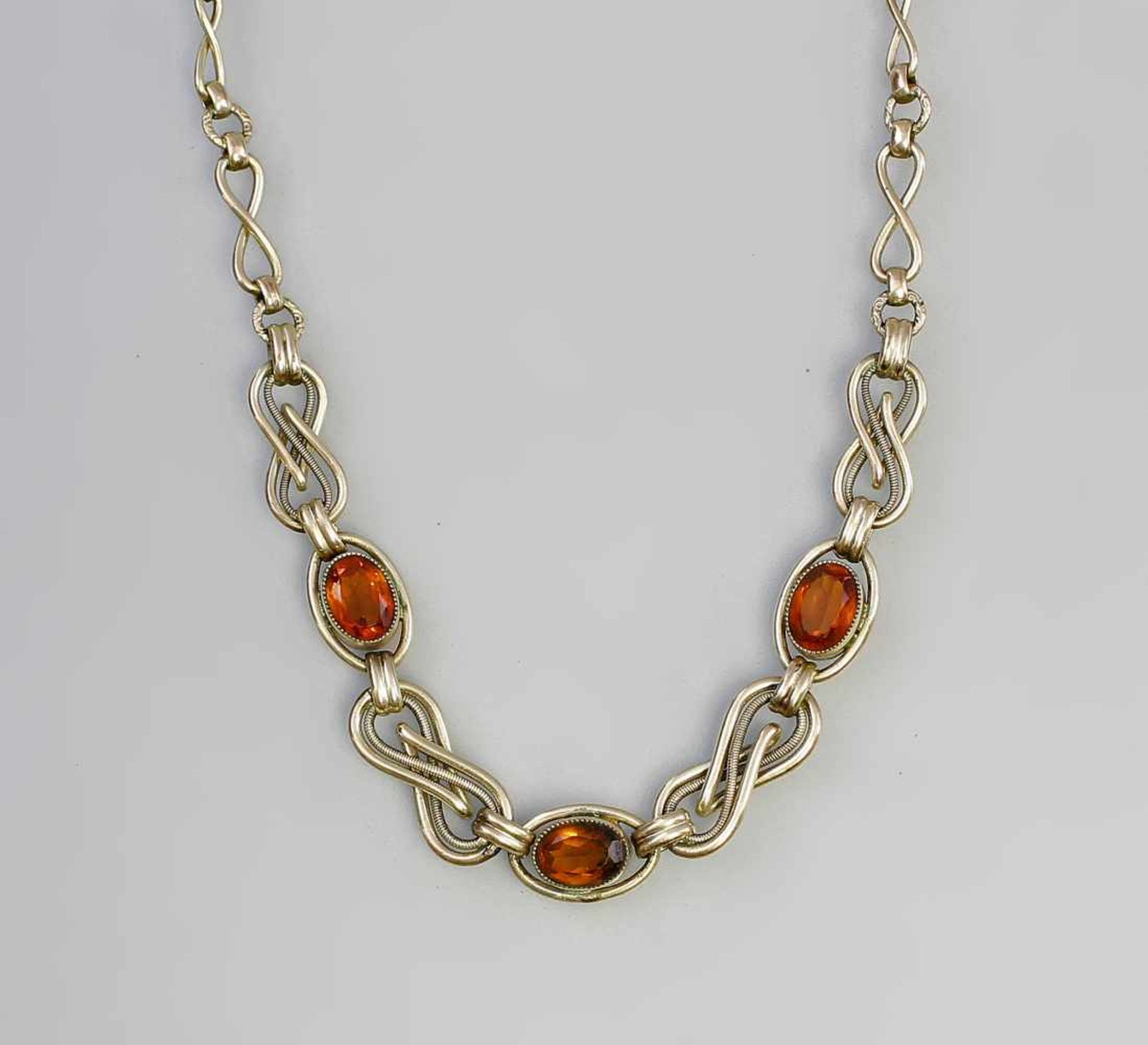 Collier Art deco mit orangefarbenen Steinen. vergoldet, 30er Jahre, verschieden geformte,