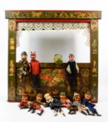 Puppentheater Anfang 20. Jh., Handarbeit aus Holz, lackiert, Vorderseite mit Aufklebern dekoriert,