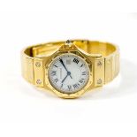 Cartier Damenarmbanduhr, Modell Santos Octagon Date, Automatik, Gehäuse 750 Gelbgold, Durchmesser 28