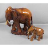 FIGURENPAAR: "Elefanten", Holz, geschnitzt, Afrika, 2. Hälfte 20. Jh.; in leichter Stilisierung